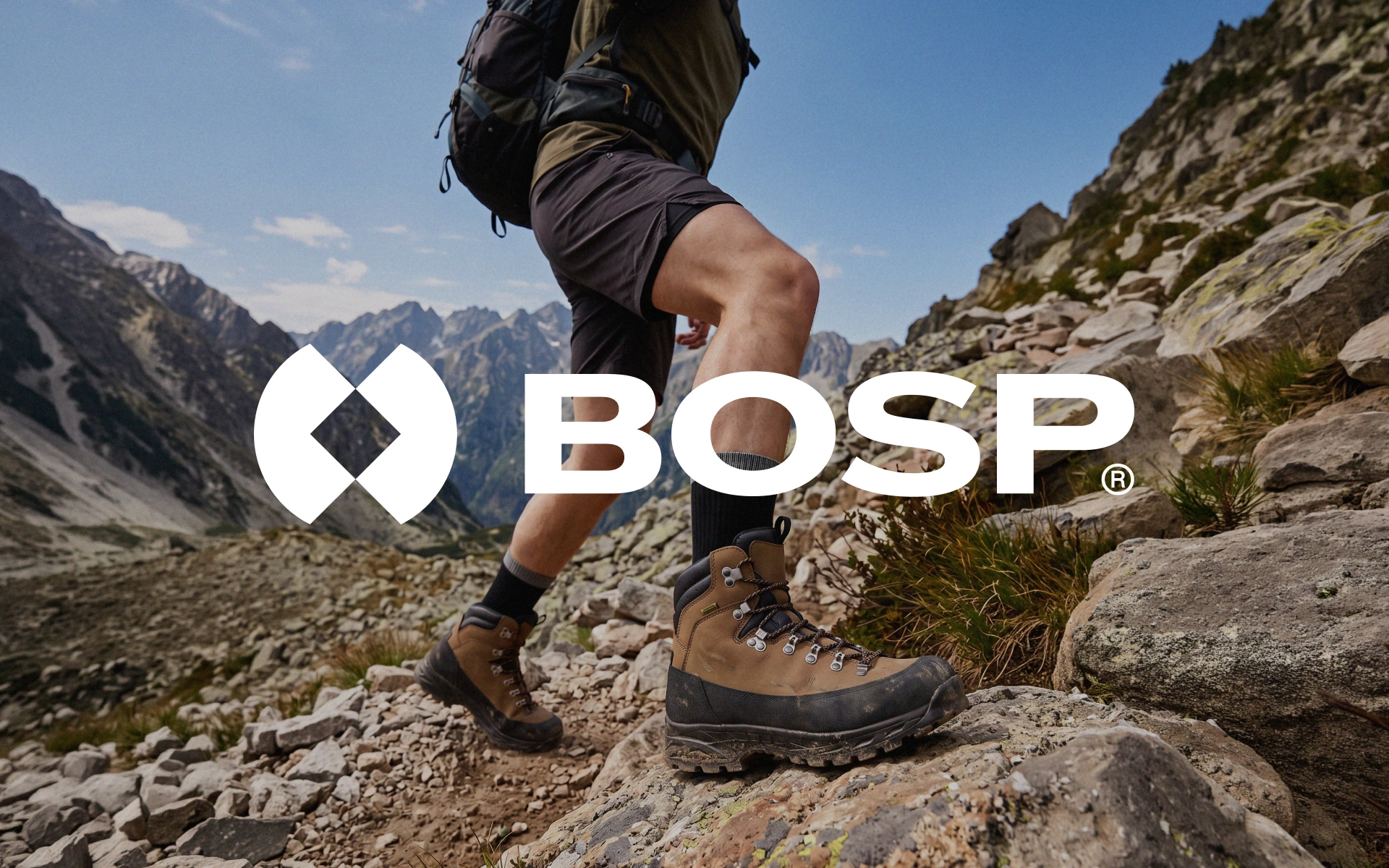 Hiker in leather boots on rocky terrain with the BOSP logo overlaid