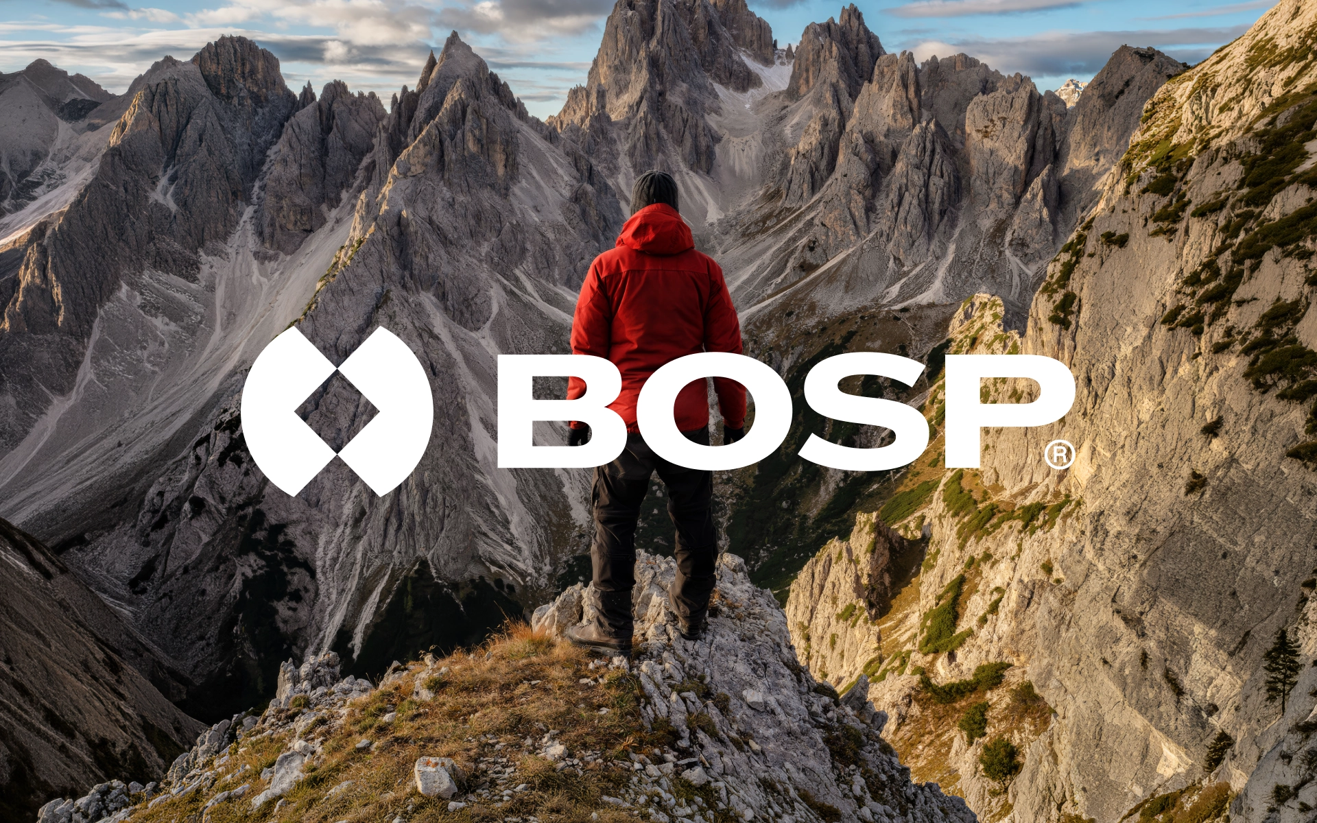 BOSP logo branding, white logo over a hiker in a red jacket on a mountain ridge